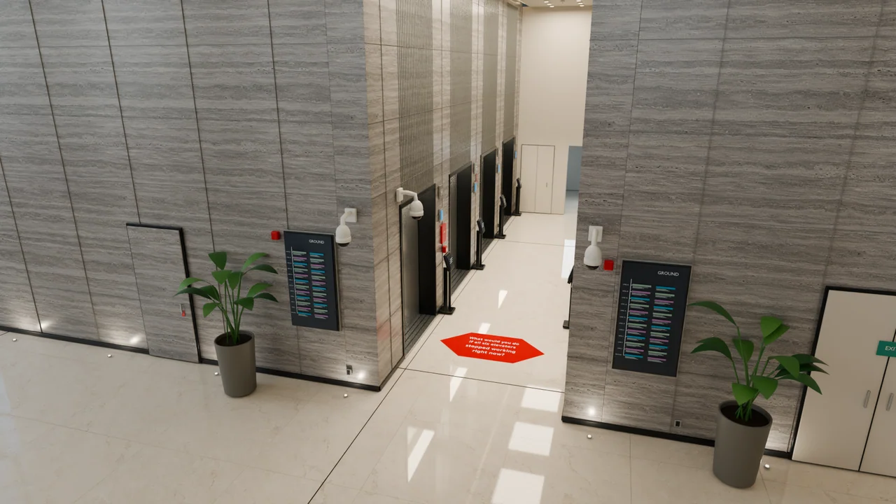 Stone surfaces, lift doors, directory signs and planting bring the material treatment into a closer interior view.