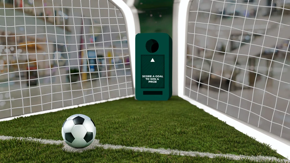 Rendered football goal installation with a ball and green interactive prize station.