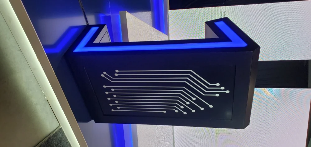 Blue illuminated installation panel with a circuit-line graphic.