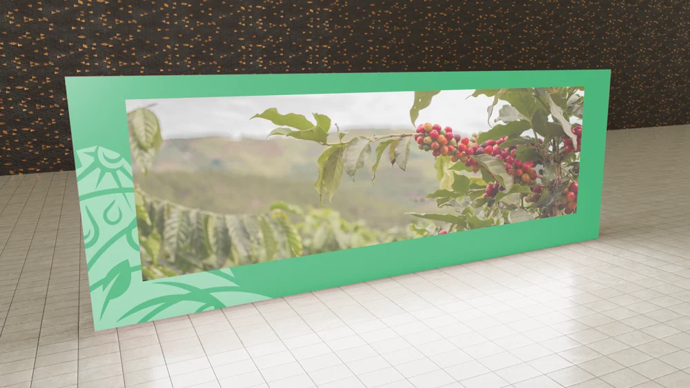 A wide mint-green display mockup featuring coffee cherries and foliage.